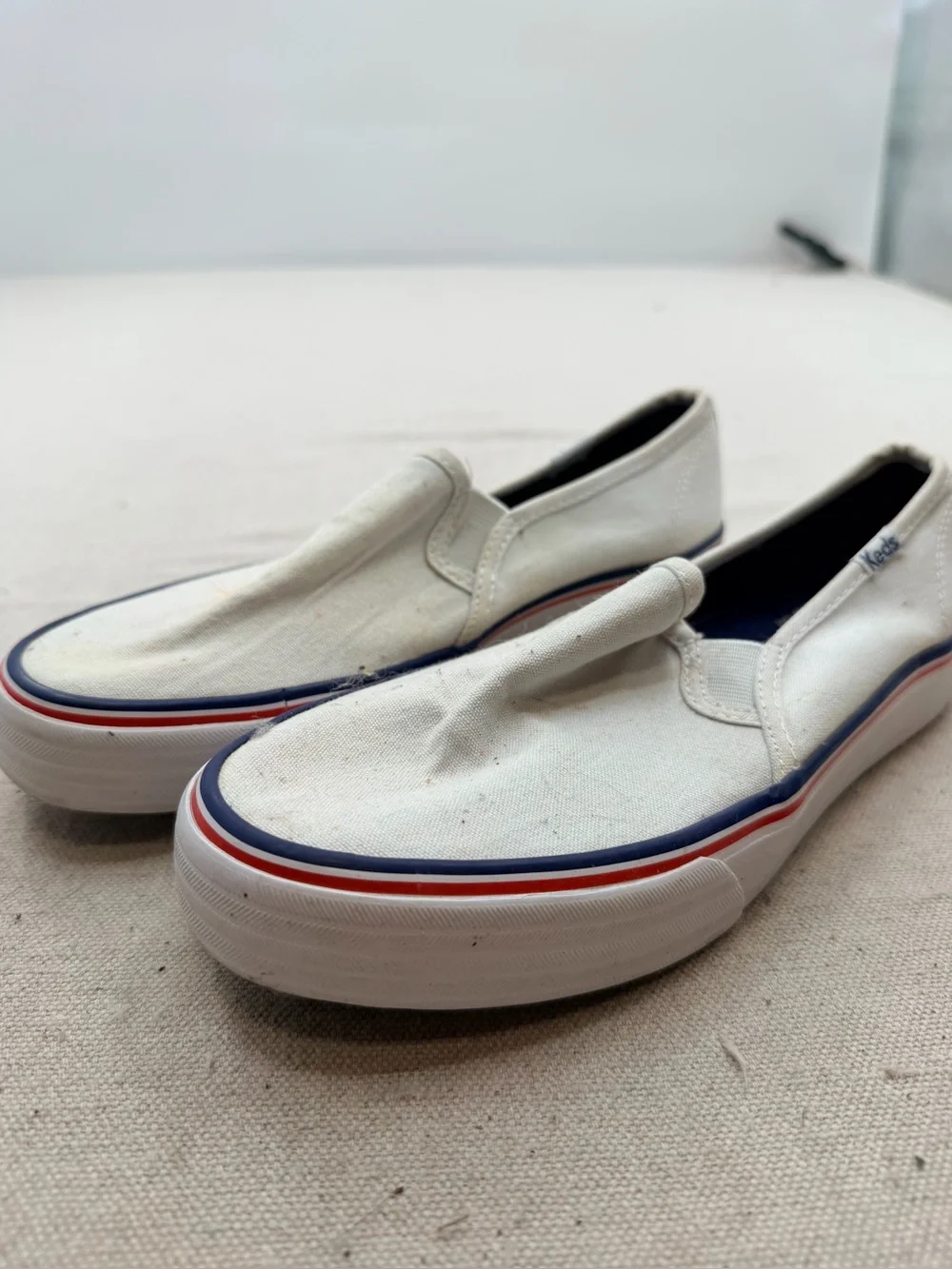 Keds White Canvas Slip-On Loafers with Red & Blue Trim